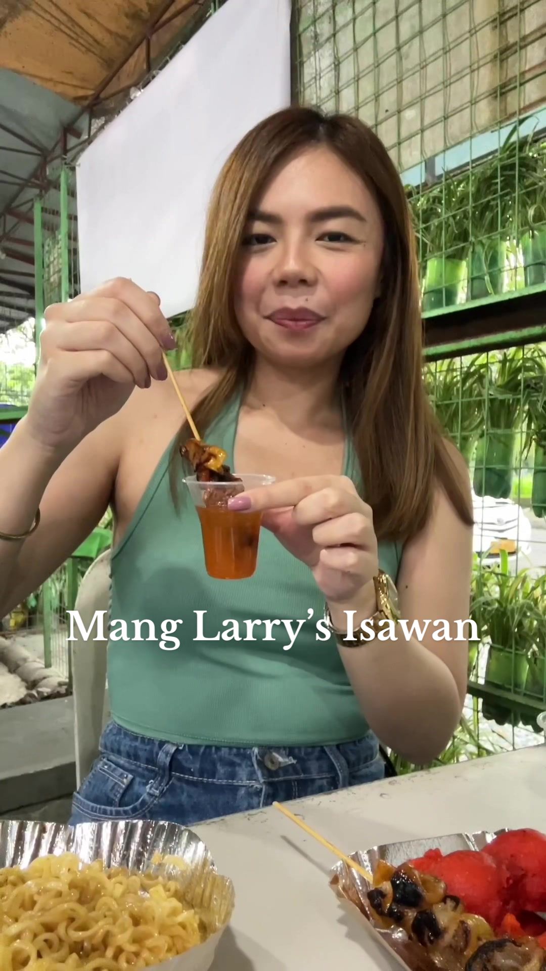 Customers enjoying street food at Mang Larry's UP Diliman